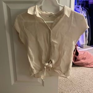 cream colored shirt